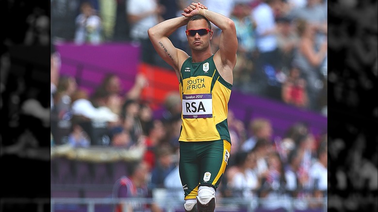 Oscar Pistorius hands on head