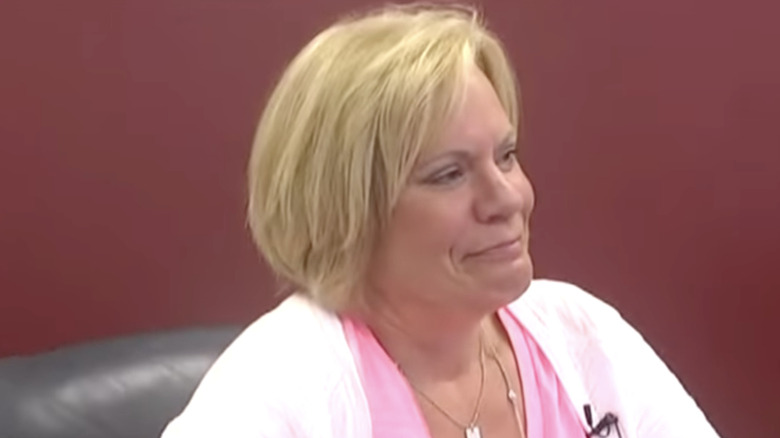 Pam Hupp testifying in court in pink shirt