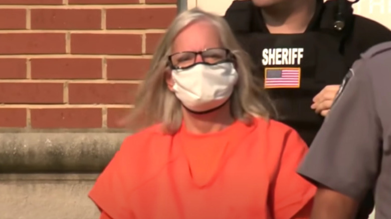 Pam Hupp in orange jumpsuit and mask