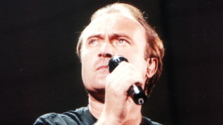 Phil Collins looking pensive on stage