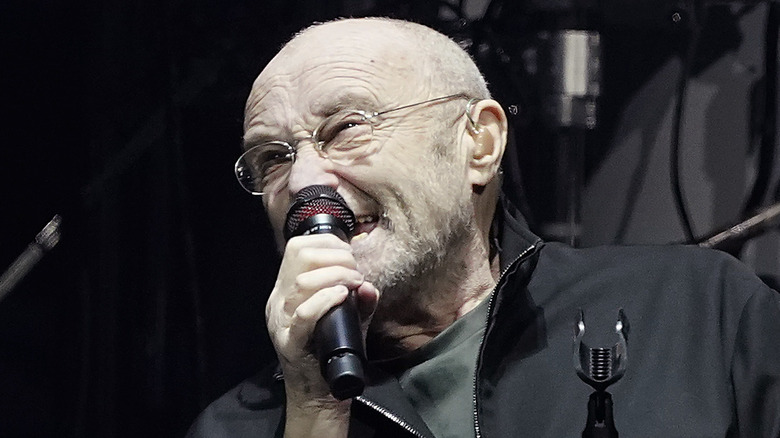 Phil Collins singing onstage in 2021