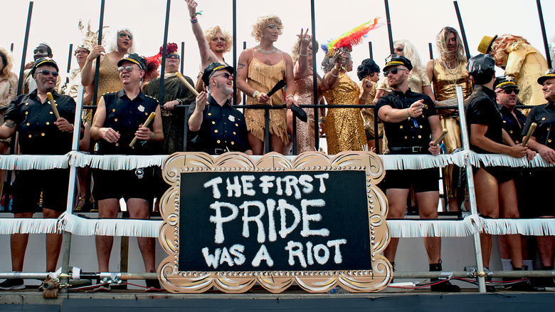 people on pride march float 