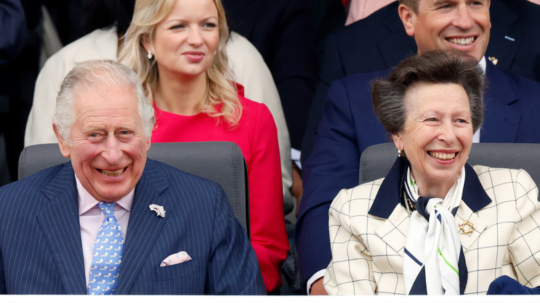 Prince Charles and Princess Anne share a laugh while taking in the Platinum Jubilee