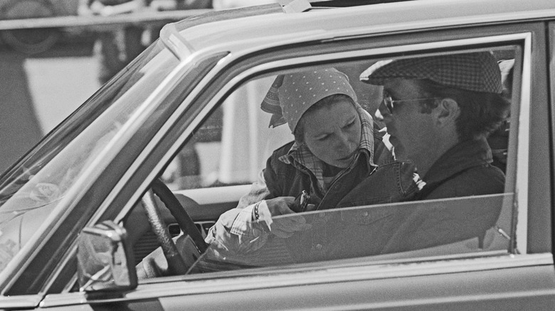 Princess Anne and her husband Mark Phillips behind the wheel