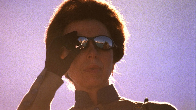 Princess Anne adjusts her sunglasses