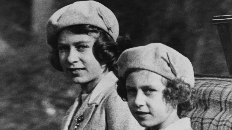 Princesses Elizabeth and Margaret ride in a carriage