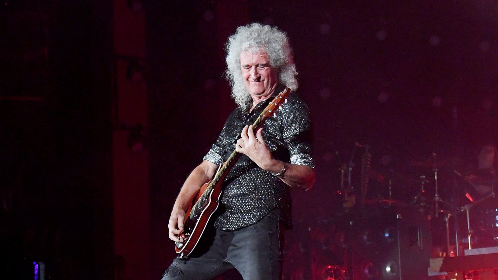 Brian May onstage in 2019