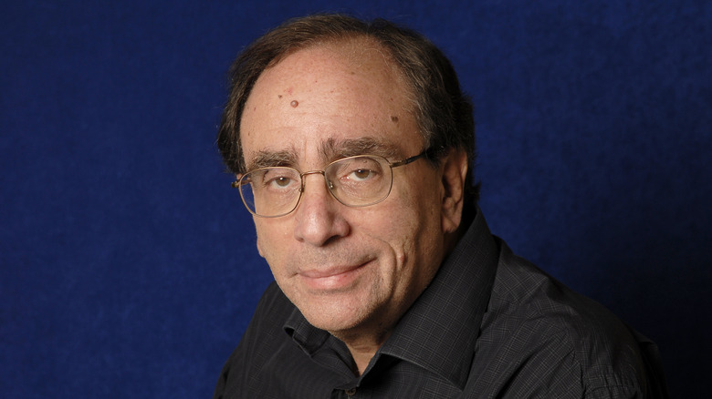 R.L. Stine smiling blue background