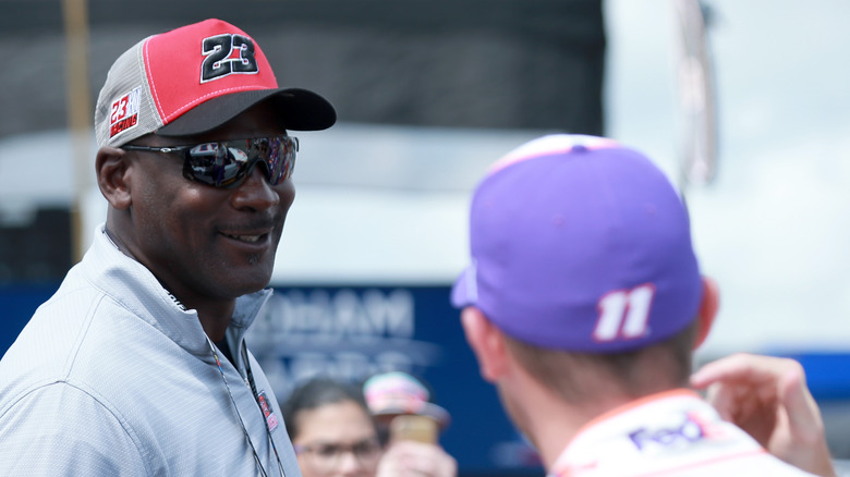 Michael Jordan smiles at Denny Hamlin