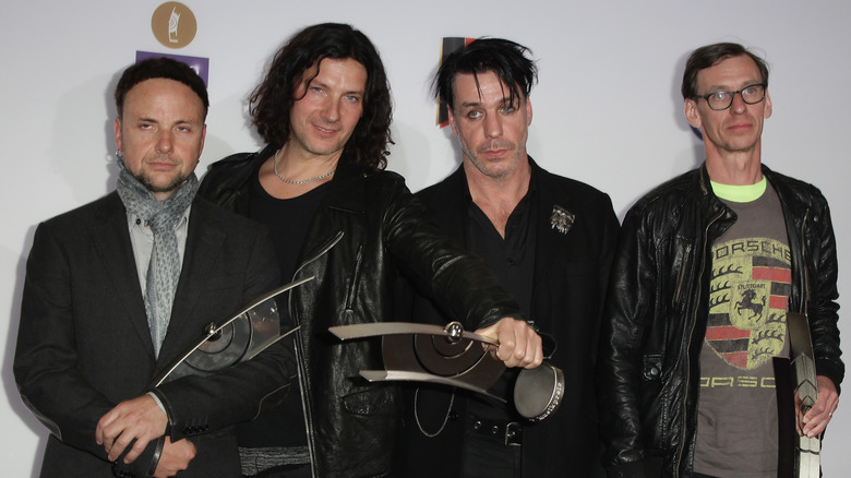 Rammstein posing with an award