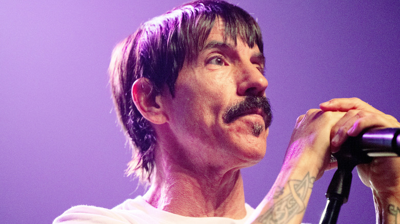 Anthony Kiedis of the Red Hot Chili Peppers looking serious while performing