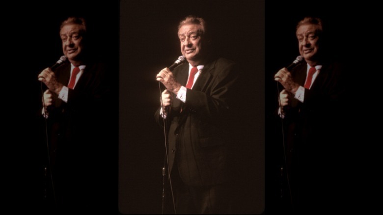 Rodney Dangerfield performing on stage