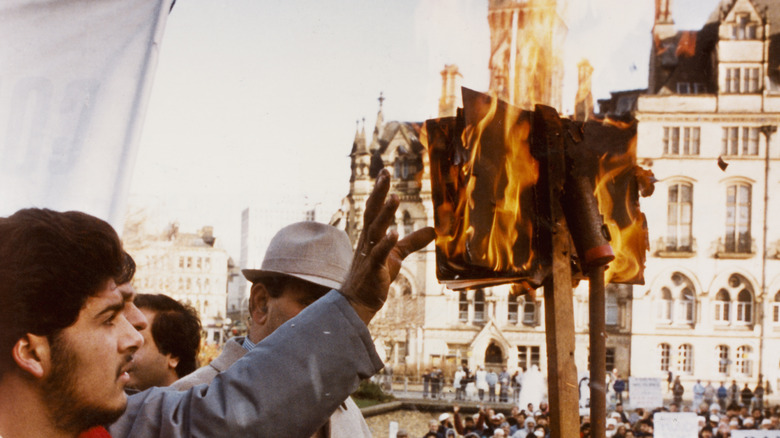 Protest in the UK with Rushdie's book being burned.