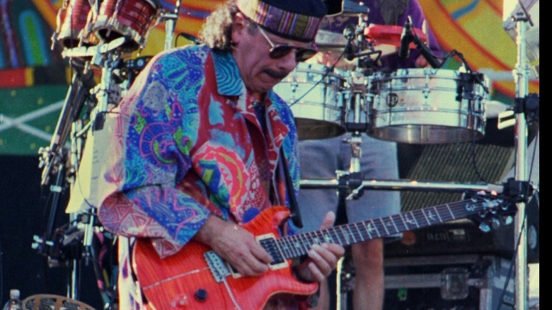 Carlos Santana performing outdoors