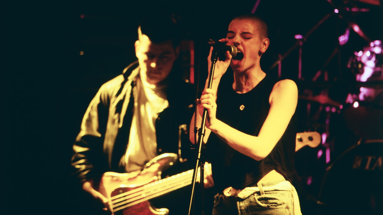 Sinéad O'Connor onstage singing angrily