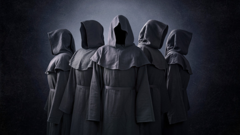 Cult members in dark robes