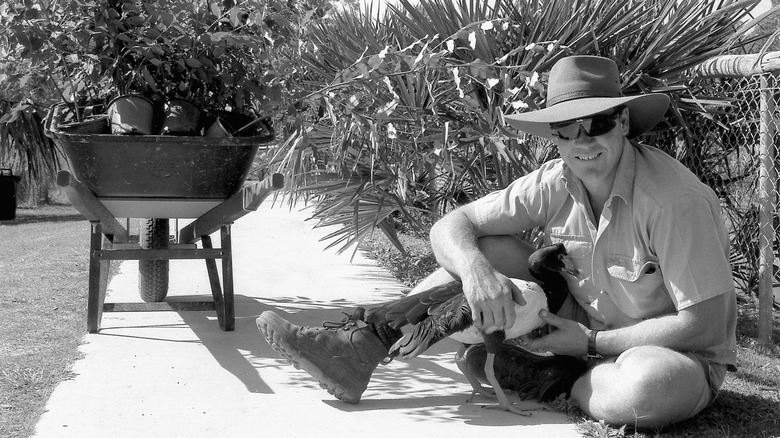 Steve Irwin holding a bird