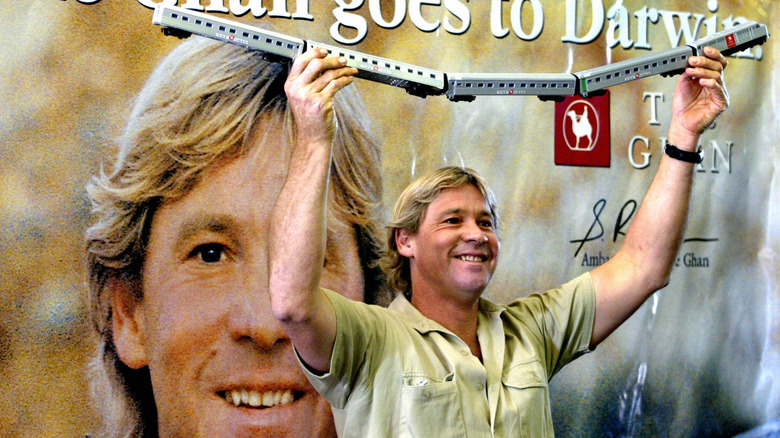 Steve Irwin holding toy train