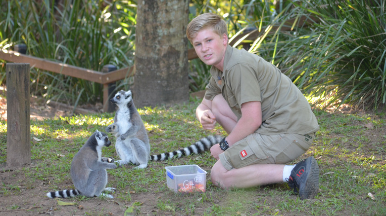 Robert Irwin posing with lemurs 