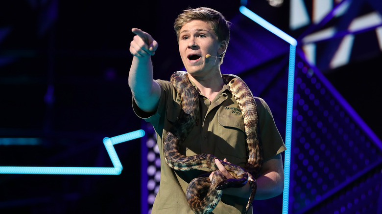 Robert Irwin holding snake