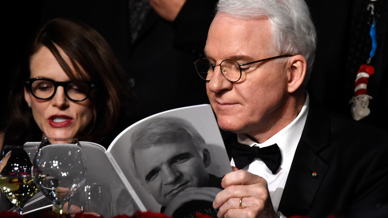 Steve Martin reading a book about himself