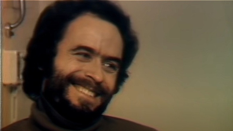 Ted Bundy with beard smiling during interview