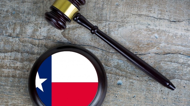 wooden mallet and Texas flag