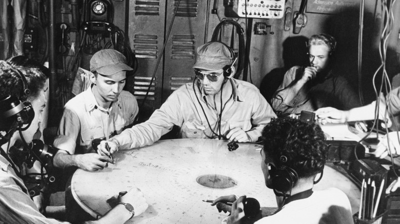 Airmen listening to radar on ship WWII