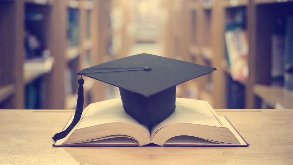 graduation cap and book