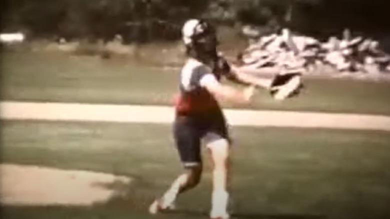 Karen pitching at a softball game