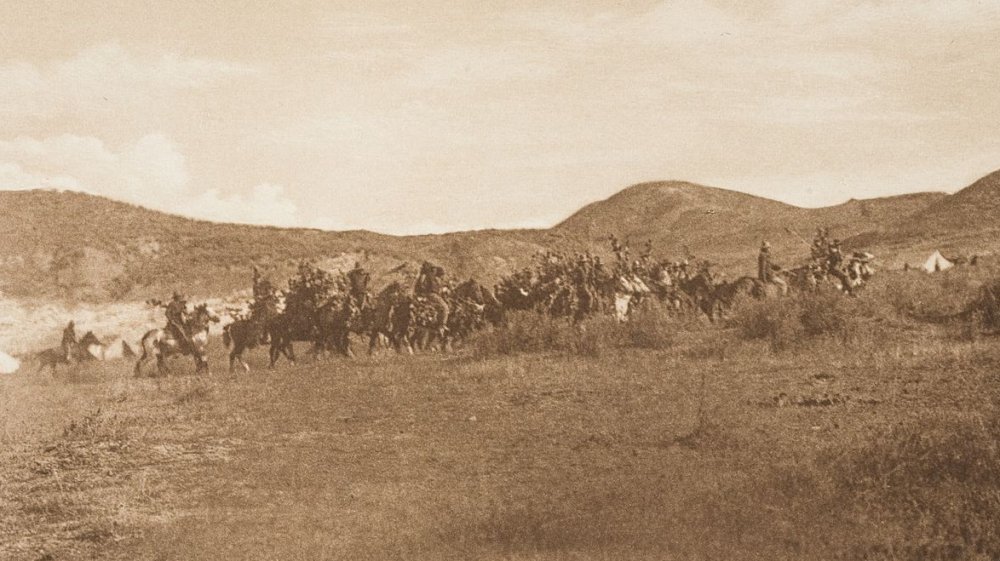 Cheyenne warrior society encircling a camp, 1910