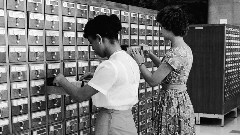 Students using card catalog