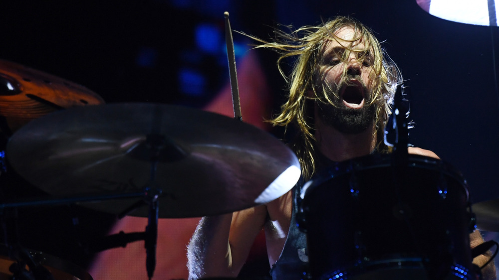 Taylor Hawkins plays the drums