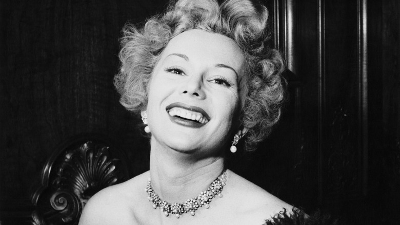 Eva Gabor smiling and posing