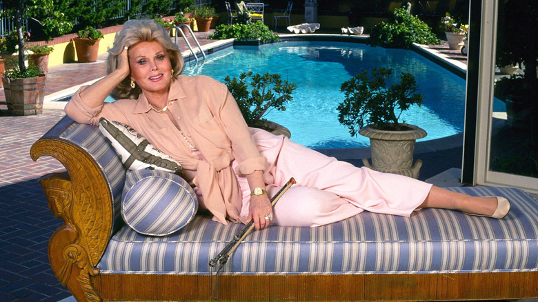 Zsa Zsa Gabor posing in chair