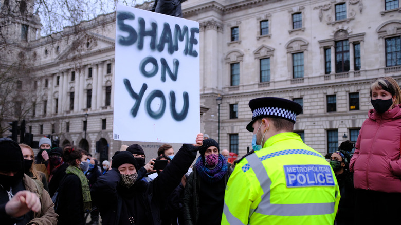 Shame on you sign protestor 