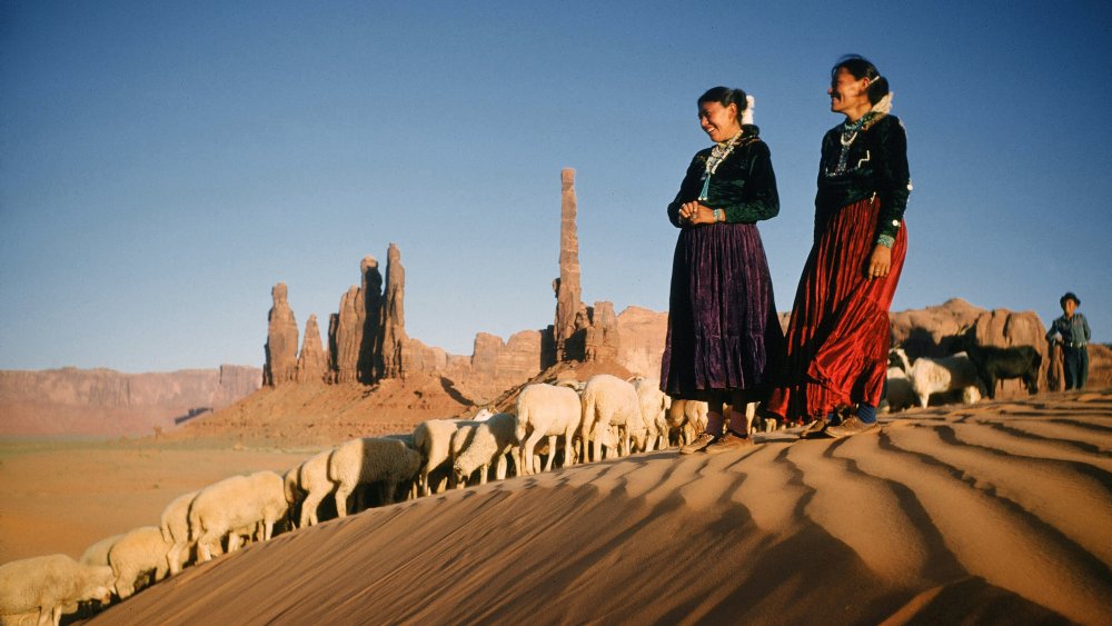 A Diné family tending to livestock in Arizona