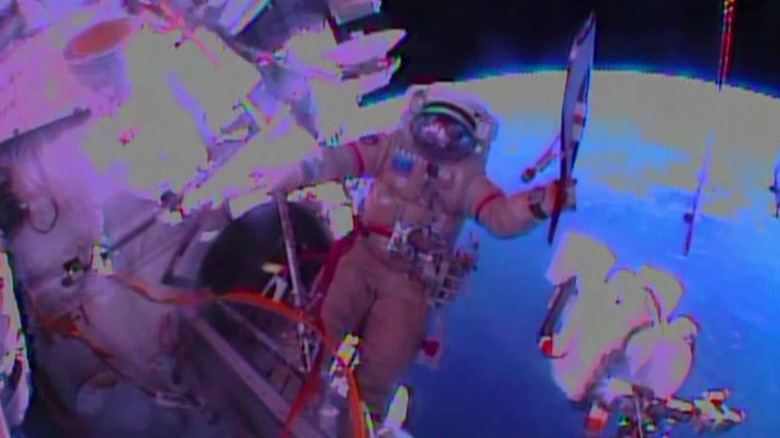 oleg kotov with olympic torch spacewalk