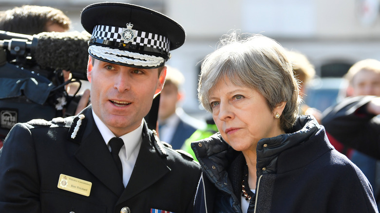 Prime Minister Theresa May with a police officer