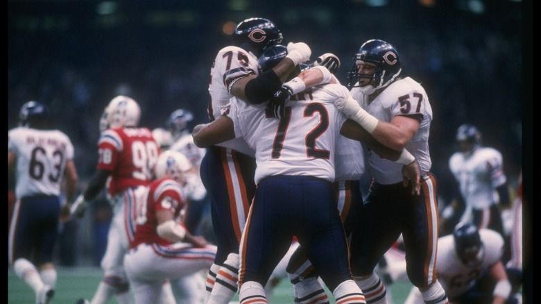 chicago bears players hugging on field