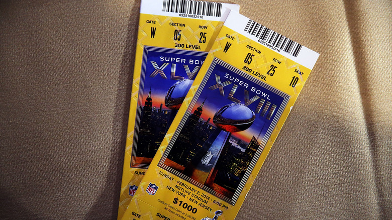 Super Bowl XLVIII tickets on brown cloth