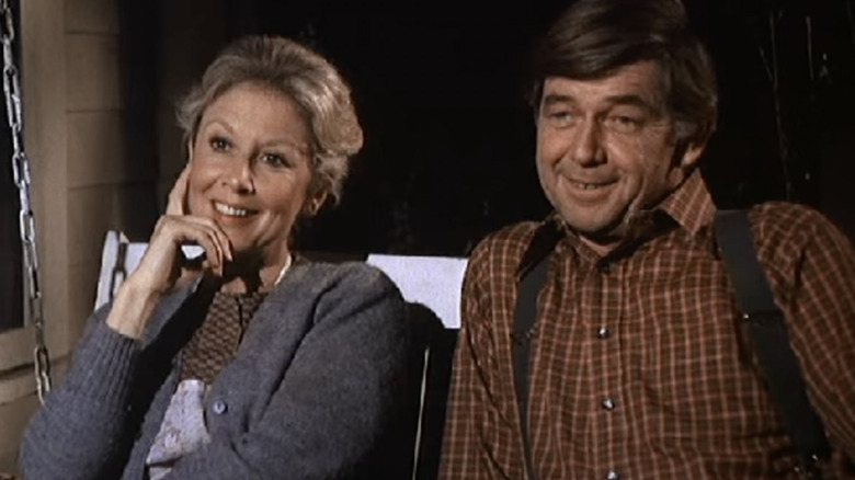 Michael Learned and Ralph Waite in porch swing on The Waltons