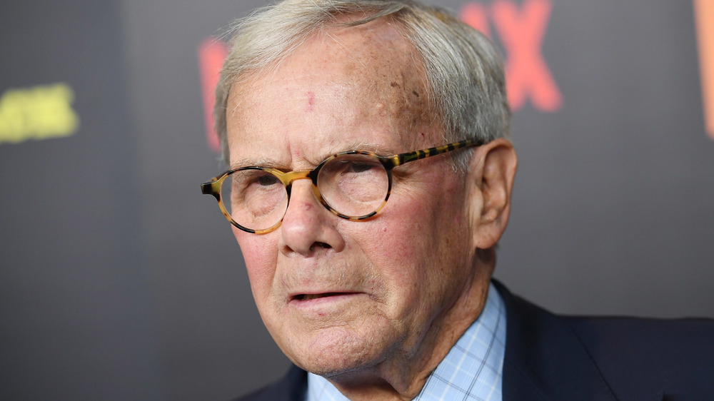 Tom Brokaw wearing glasses