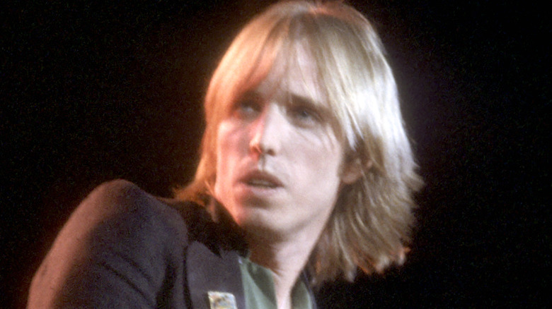 Tom Petty on stage looking off