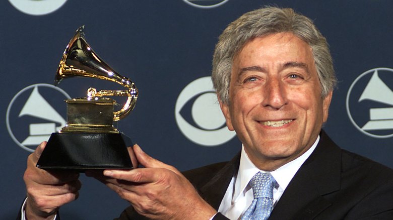 Tony Bennett holding a Grammy