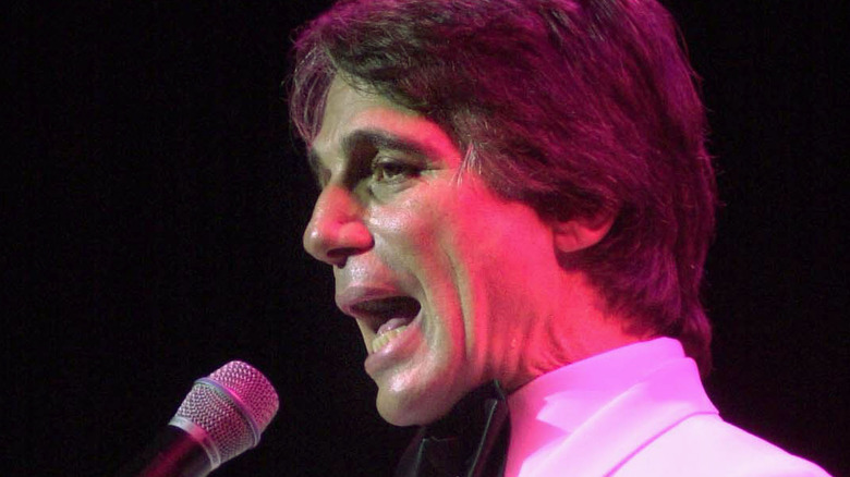 Tony Danza singing red-lit