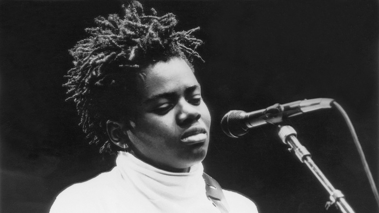 Tracy Chapman on stage with microphone