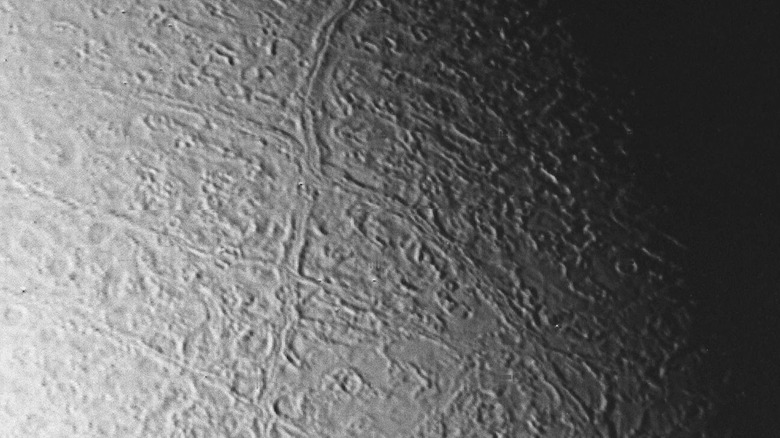 Fault lines on Triton's surface.