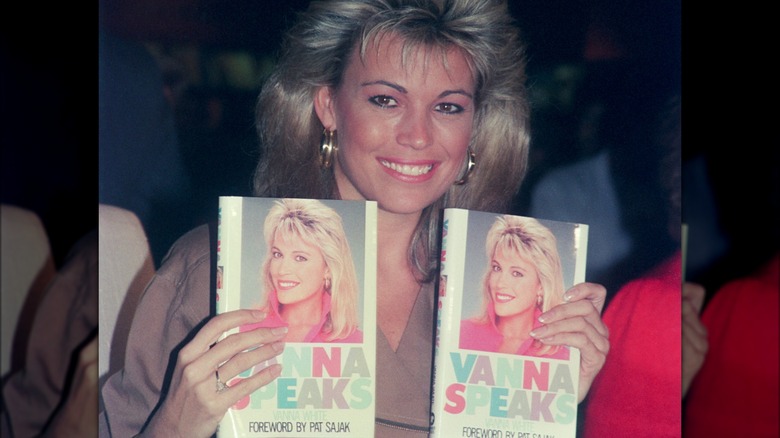 Vanna White holding copies of her book