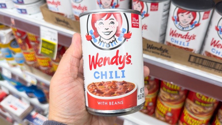 Canned Wendy's chili in hand